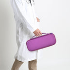 Healthcare professional carrying a closed purple hard stethoscope case