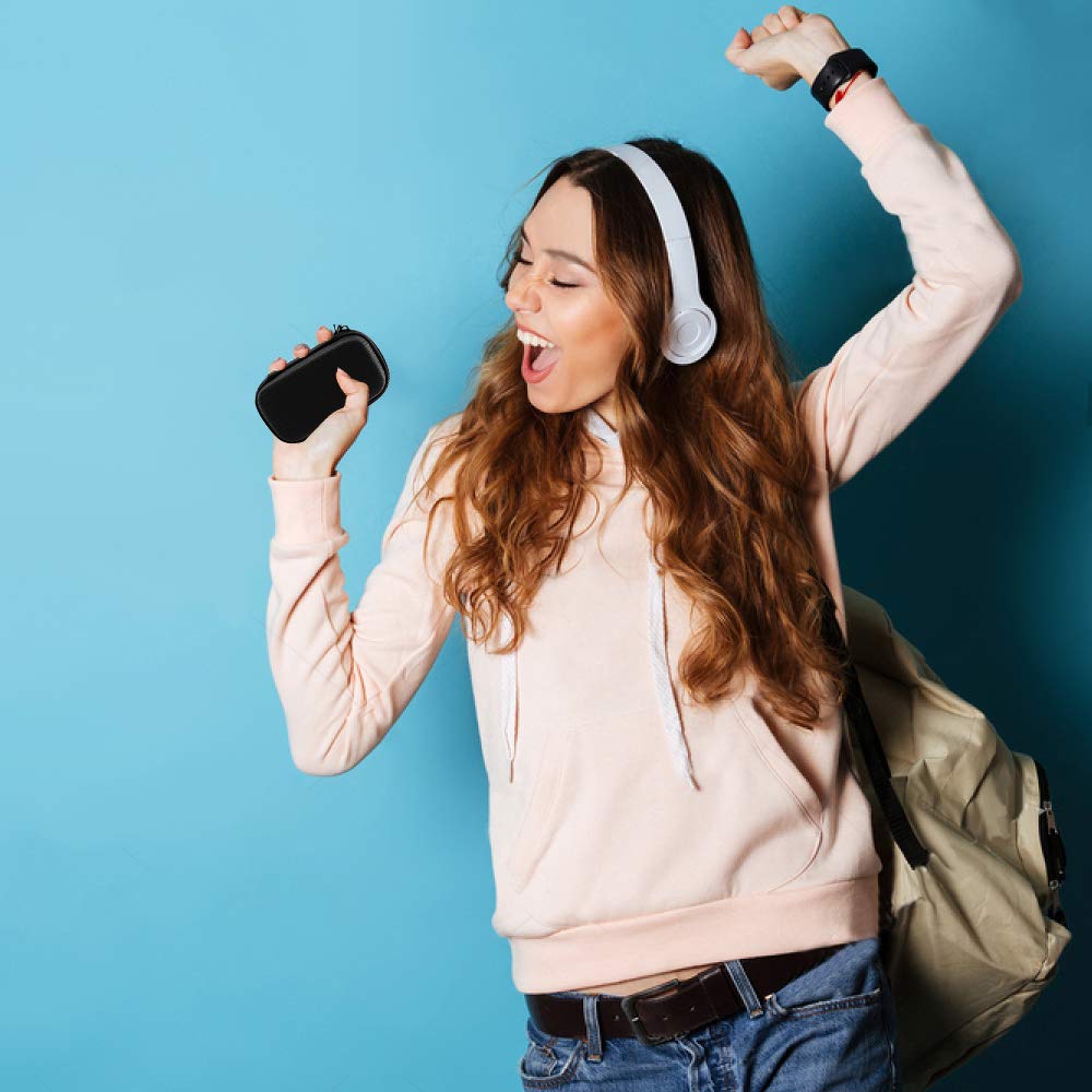 Woman wearing headphones and holding the black portable music player case