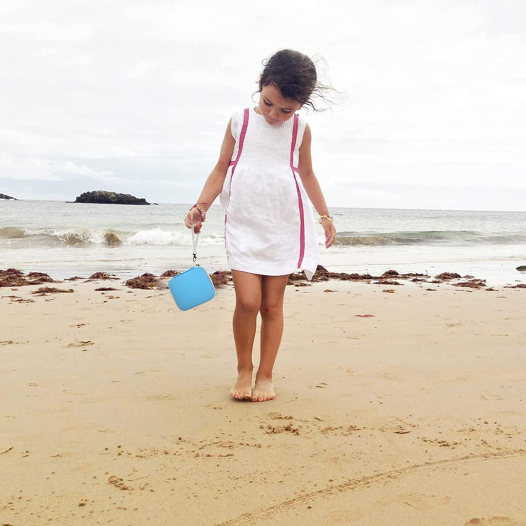 Blue kids instant print camera case open beside a child using the camera with a parent