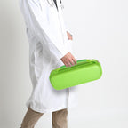 Healthcare professional carrying a closed bright green hard stethoscope case