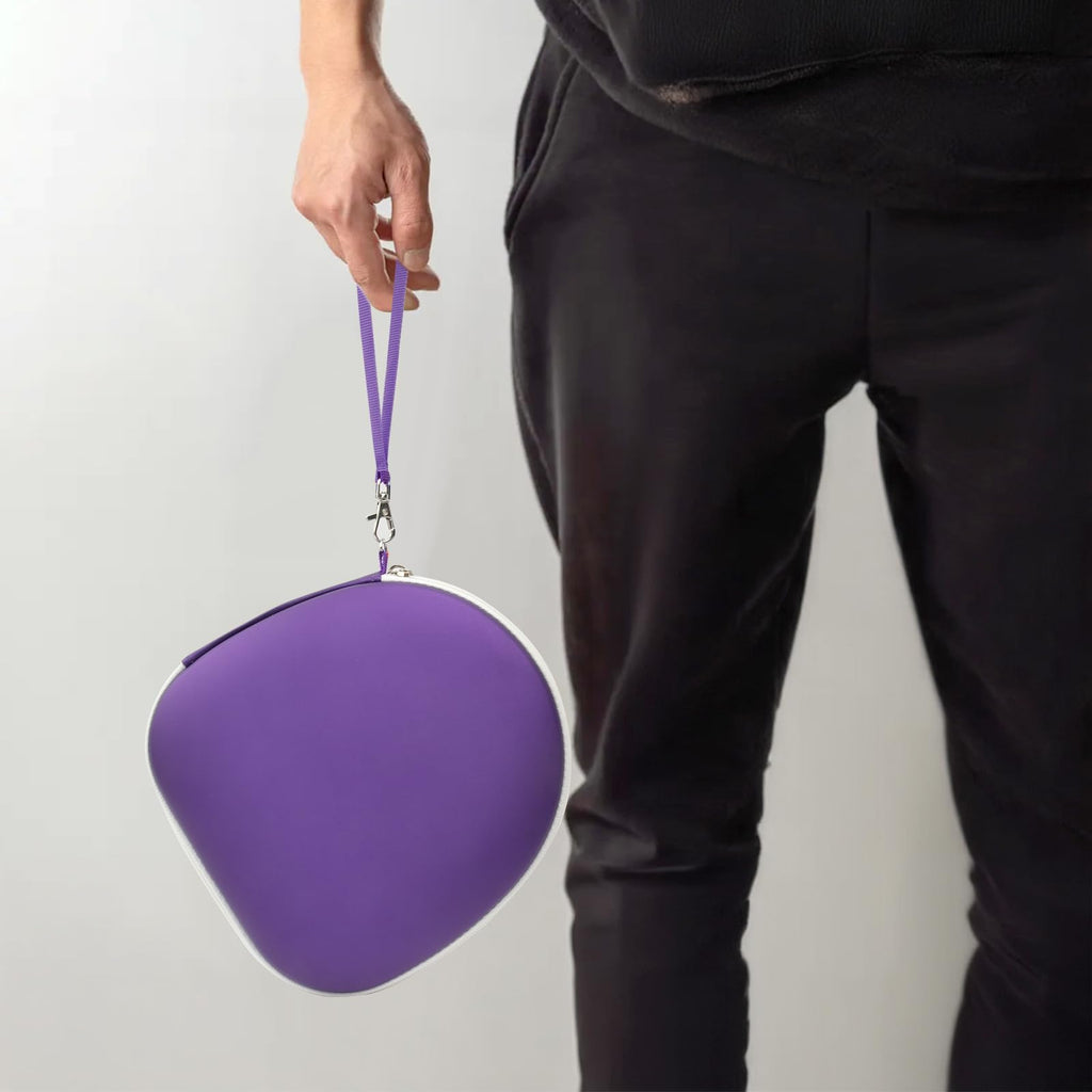 Person carrying the purple headphone case by its wrist strap