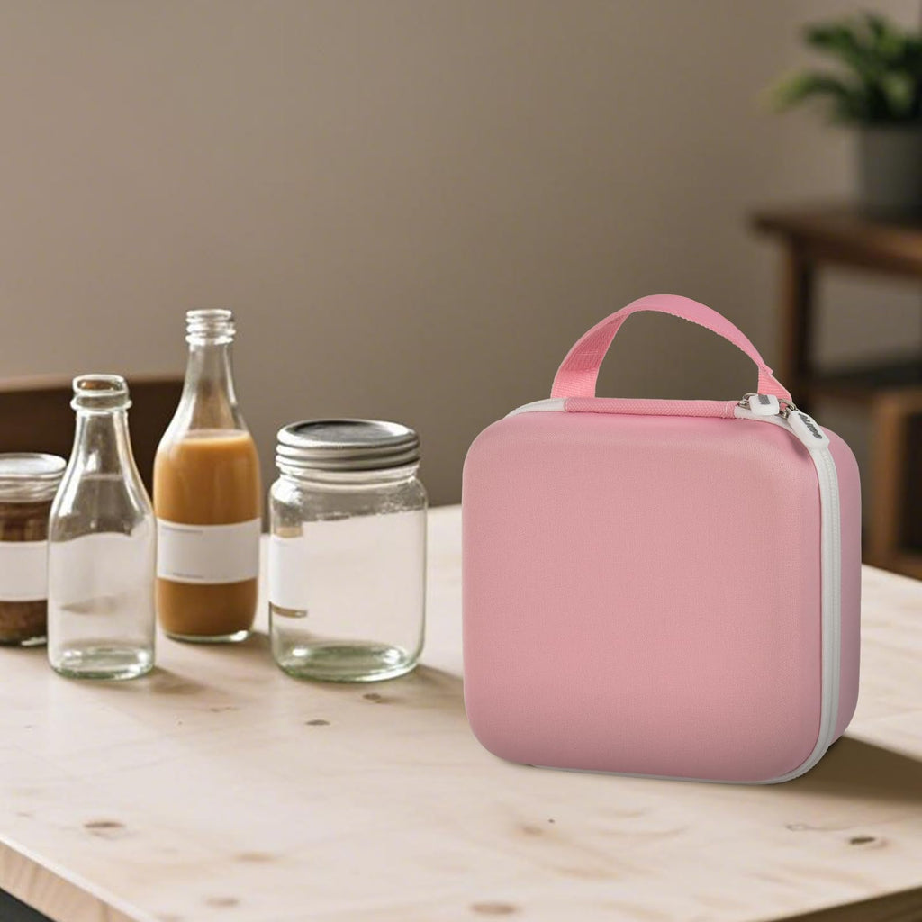 Person carrying the pink NIIMBOT label maker case by its top handle