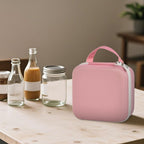 Person carrying the pink NIIMBOT label maker case by its top handle