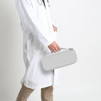 Healthcare professional carrying a closed gray hard stethoscope case