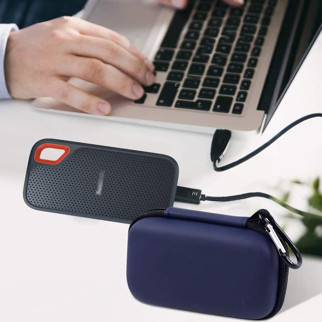 Navy and gray SSD cases beside a laptop and portable drive