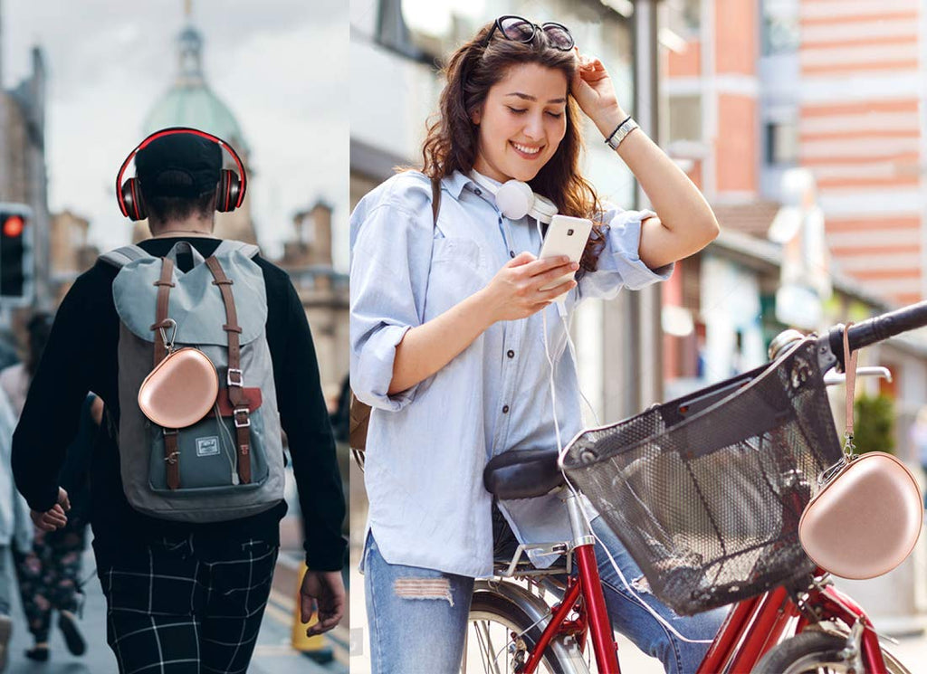Rose gold headphone case attached to a backpack and carried by a traveler