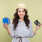 Woman holding the blue camera case beside a compact digital camera