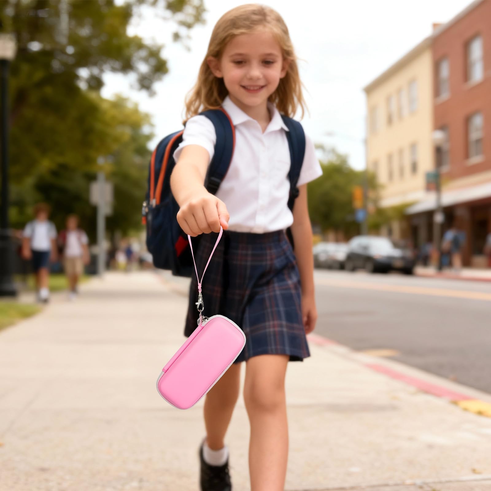Student carrying the pink 3D printing pen case by its wrist strap