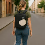 Beige headphone case attached to the outside of a backpack