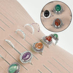 Rings and earrings displayed in the pink organizer's parallel jewelry slots