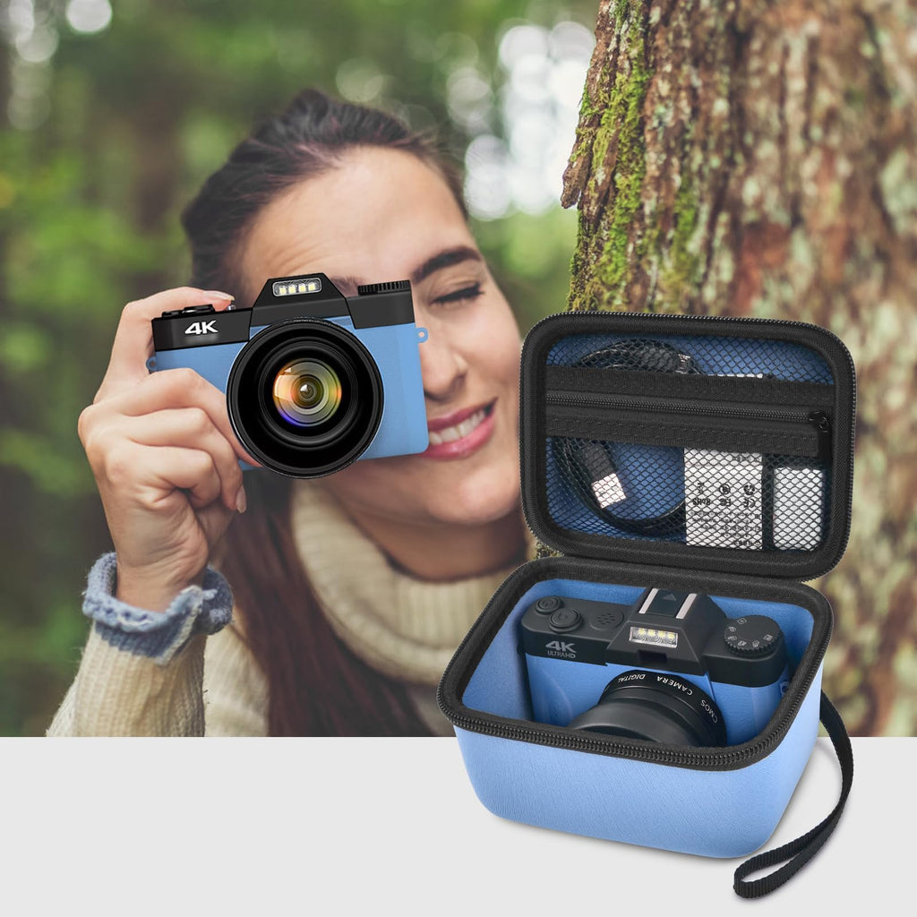 Photographer using a compact camera beside the open blue organizer