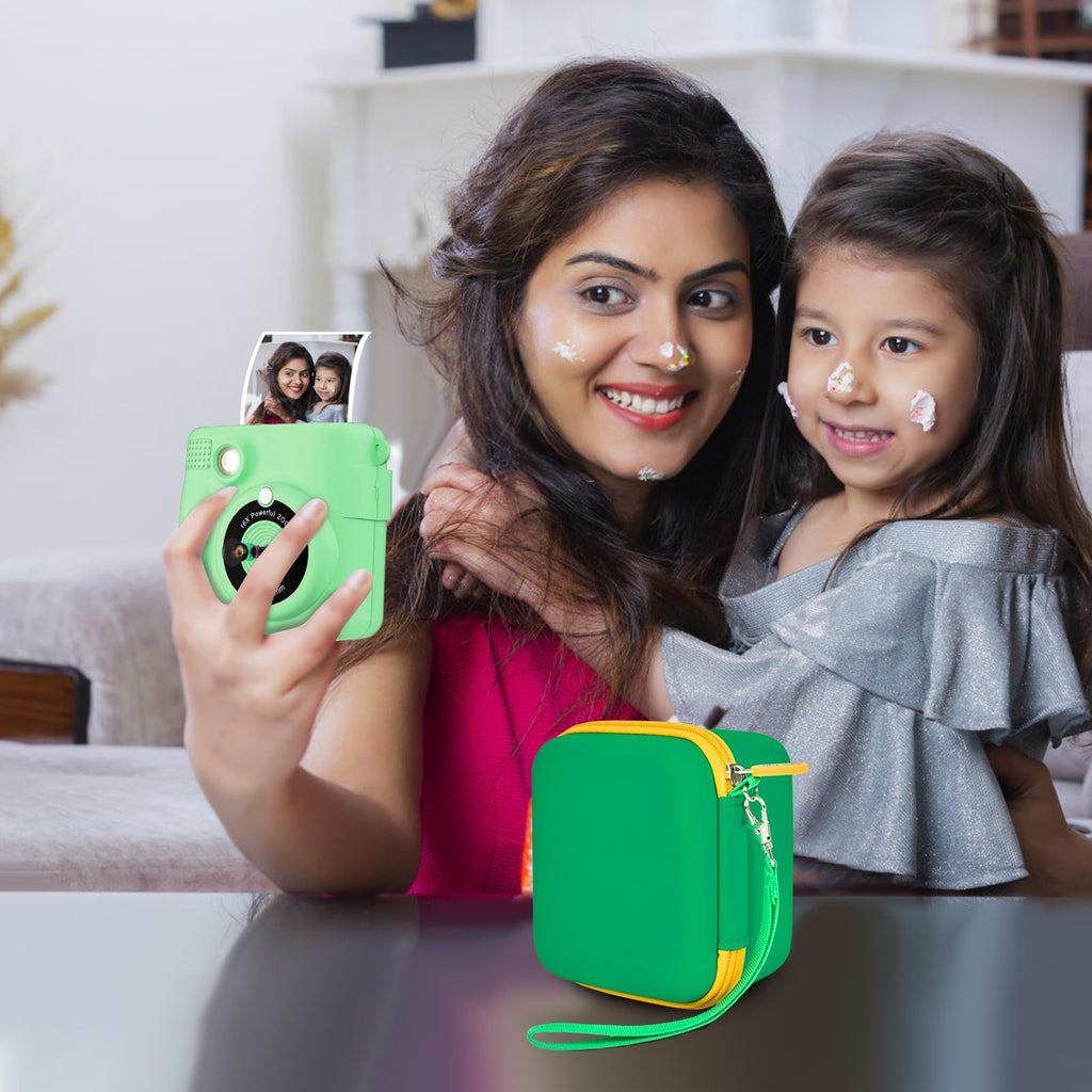 Green kids instant print camera case open beside a child using the camera with a parent