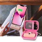 Open pink case organizing a mini power bank and cable beside a charging phone