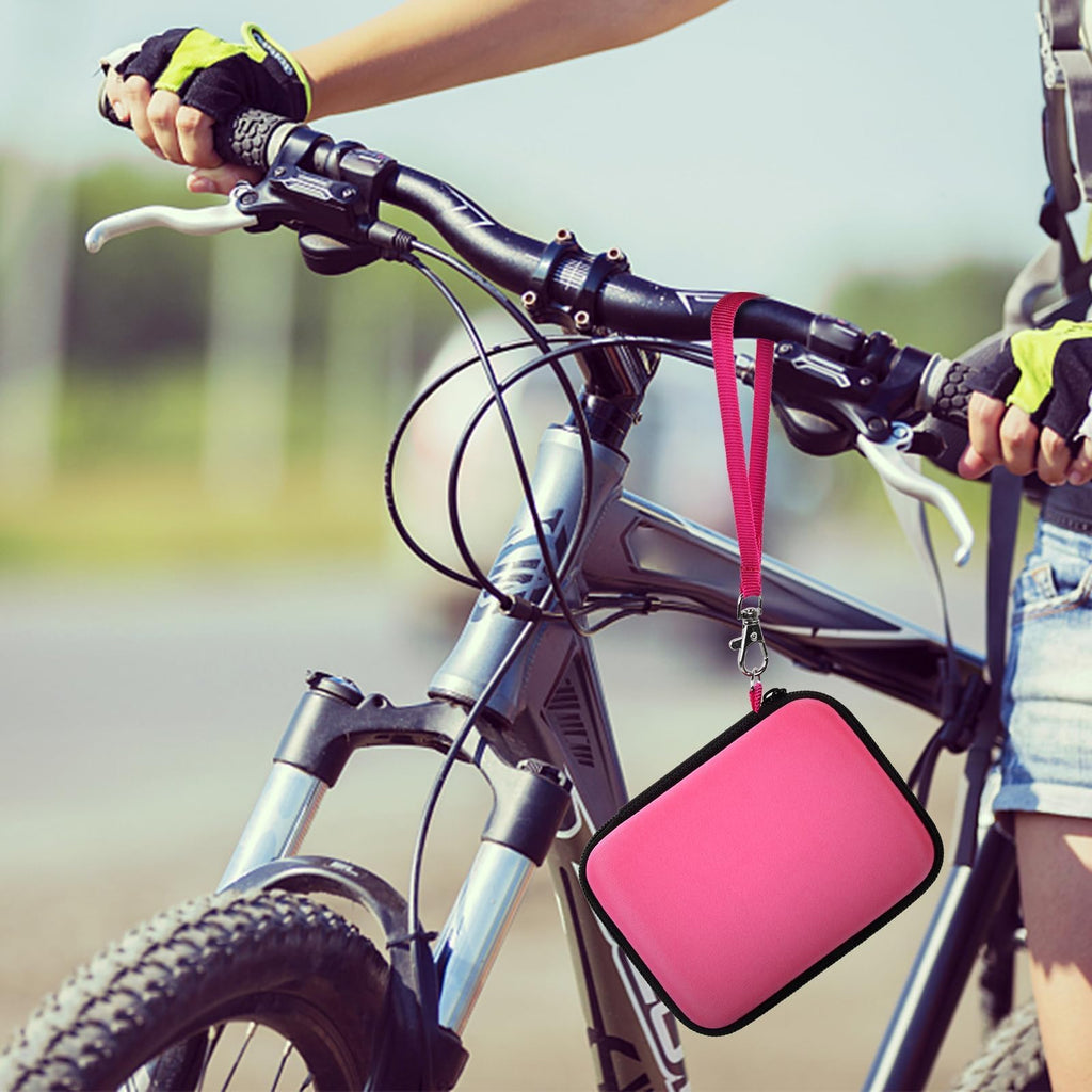 Hot pink camera case attached to a bicycle handlebar