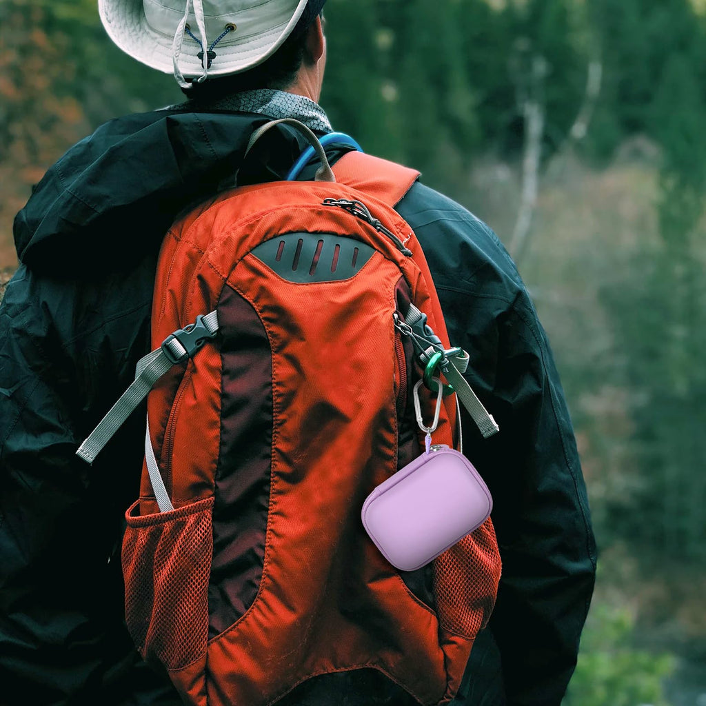 Lavender Crucial SSD case clipped to a hiking backpack