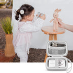 White protective digital camera case shown beside a child using a compact camera