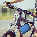 Blue camera case attached to a bicycle handlebar