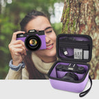 Photographer using a compact camera beside the open purple organizer