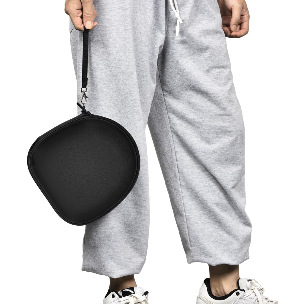 Person carrying the black headphone case by its wrist strap