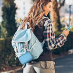 Blue mini power bank case attached to a backpack for travel