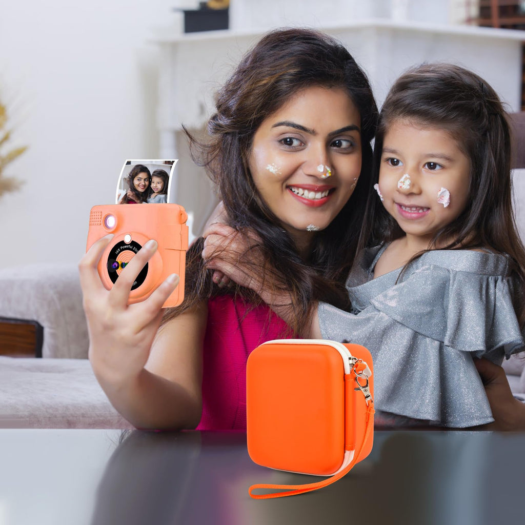 Orange kids instant print camera case open beside a child using the camera with a parent