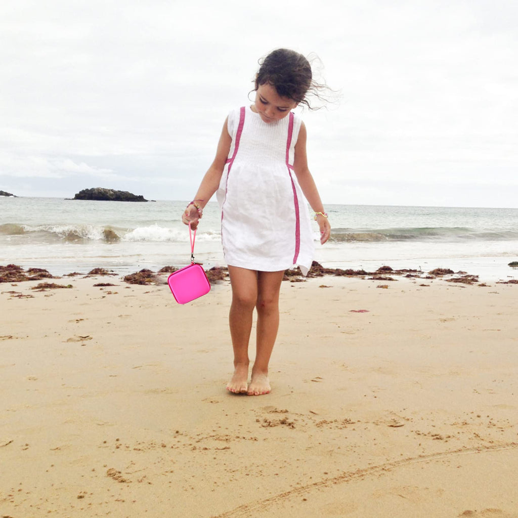 Magenta kids instant print camera case carried by a child outdoors