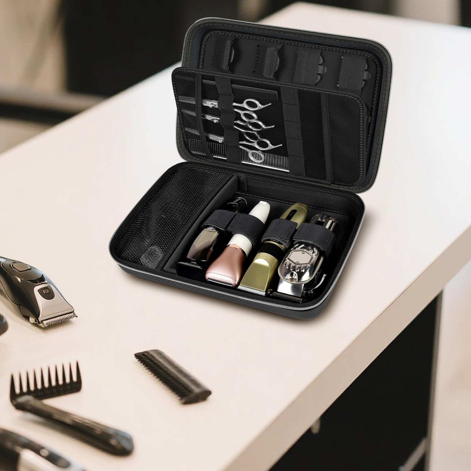 Open black clipper case organizing clippers, bottles, scissors, combs, and guards on a counter