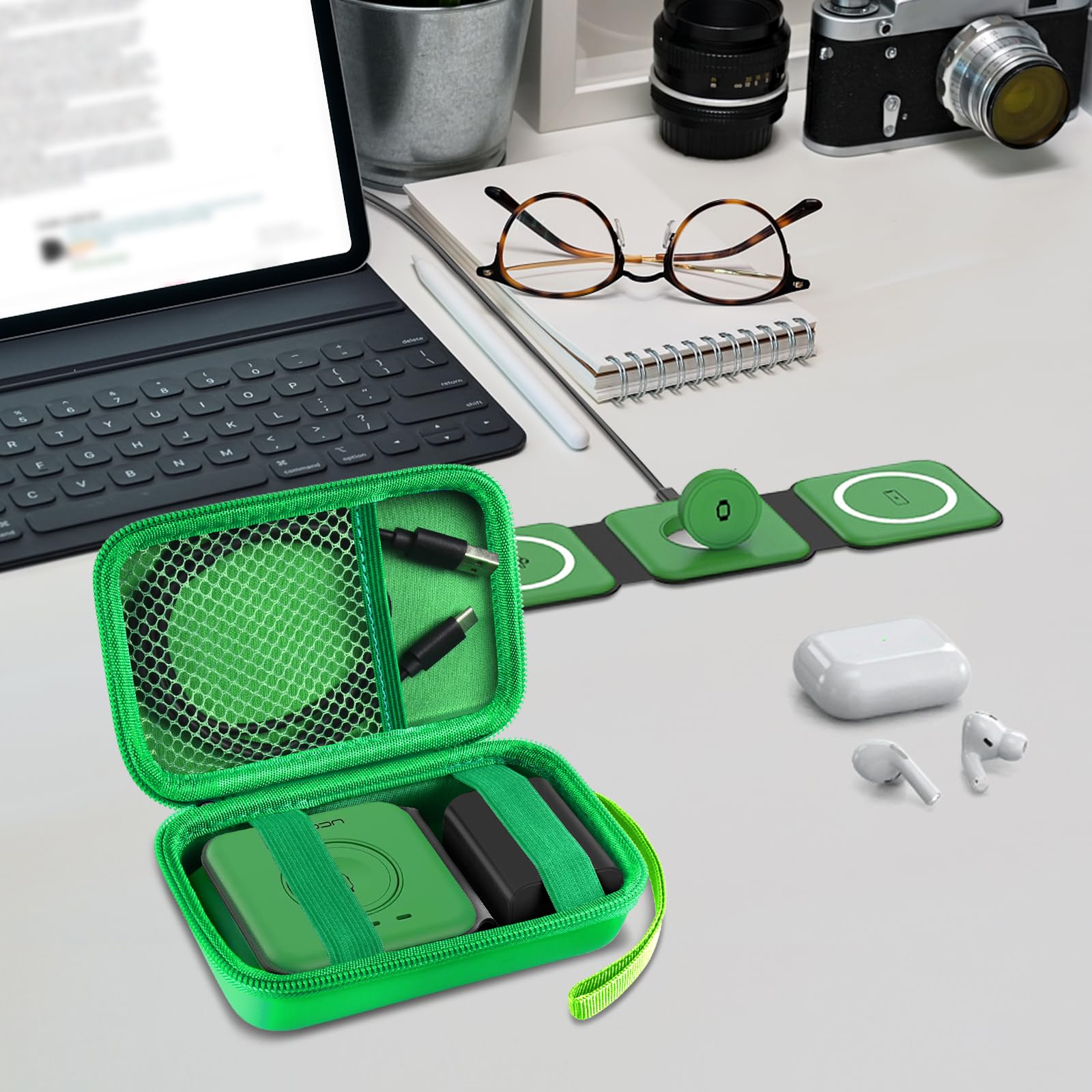 Open green case organizing a foldable magnetic charger, cable, and adapter on a desk