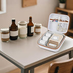Open white and tan NIIMBOT label maker organizer beside bottles and jars