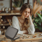 Woman using the gray ring organizer on a jewelry worktable