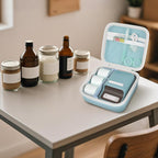 Open light blue NIIMBOT label maker organizer beside bottles and jars