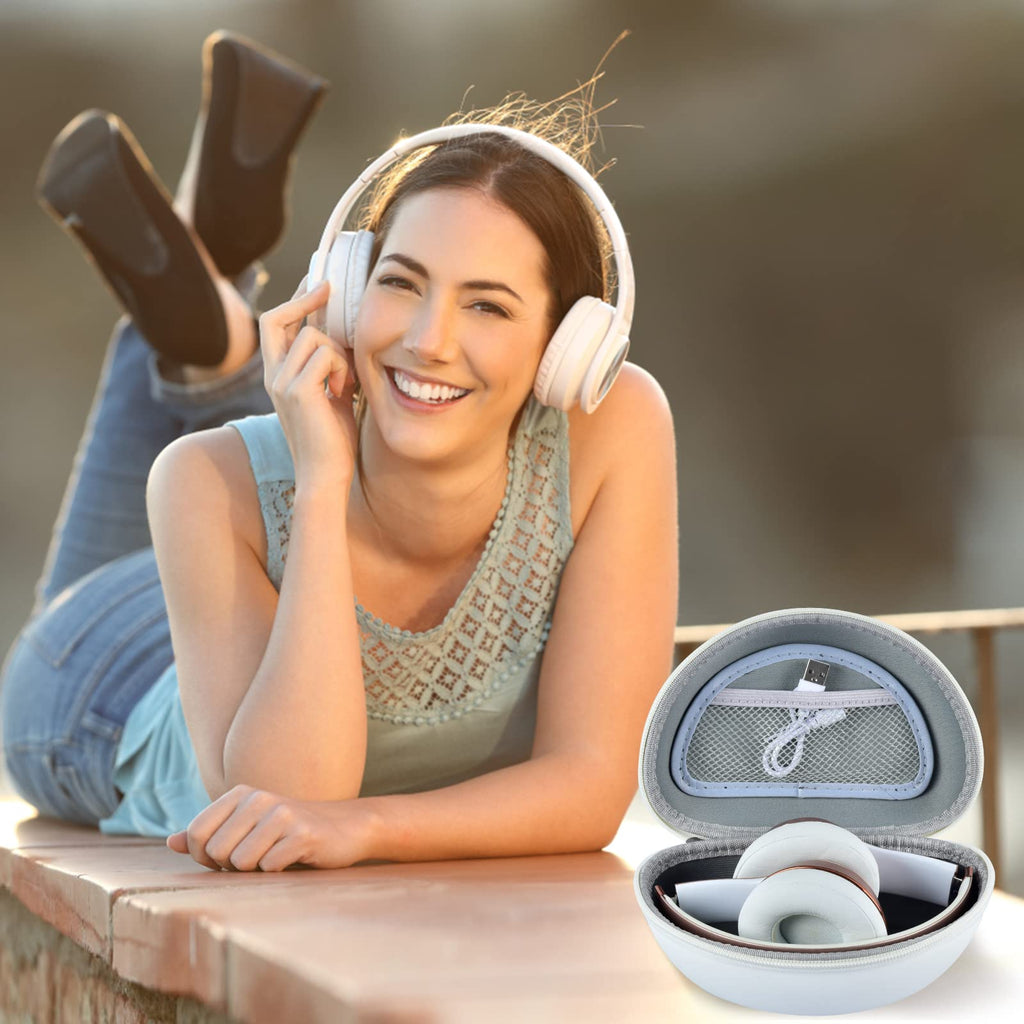 Woman wearing headphones beside the open white carrying case