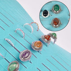 Rings and earrings displayed in the blue organizer's parallel jewelry slots