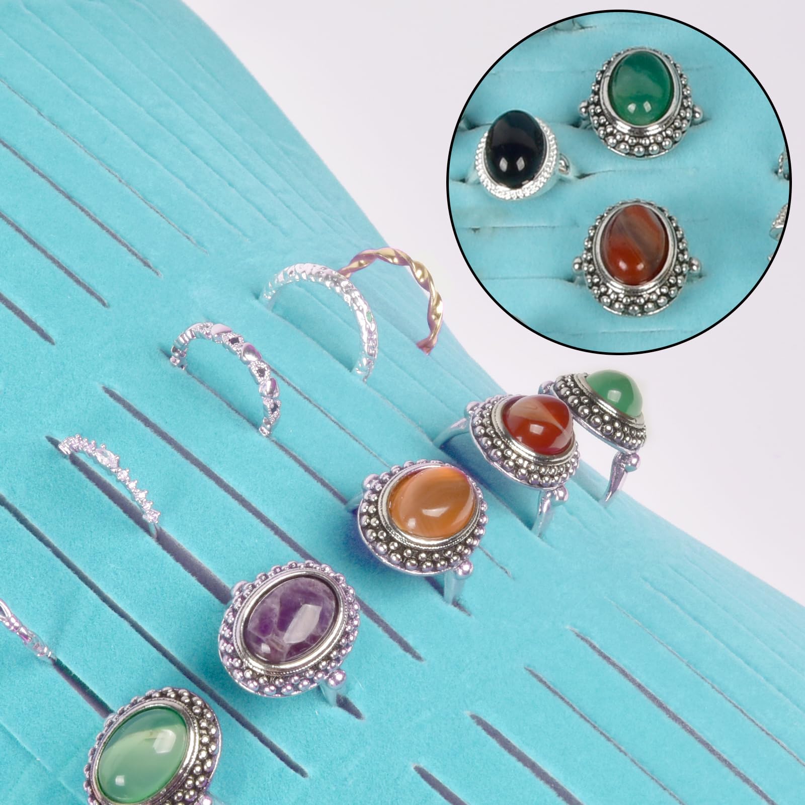 Rings and earrings displayed in the blue organizer's parallel jewelry slots