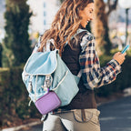 Purple mini power bank case attached to a backpack for travel