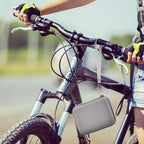 Gray camera case attached to a bicycle handlebar