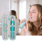 Woman brushing beside the open white and teal toothbrush travel holder