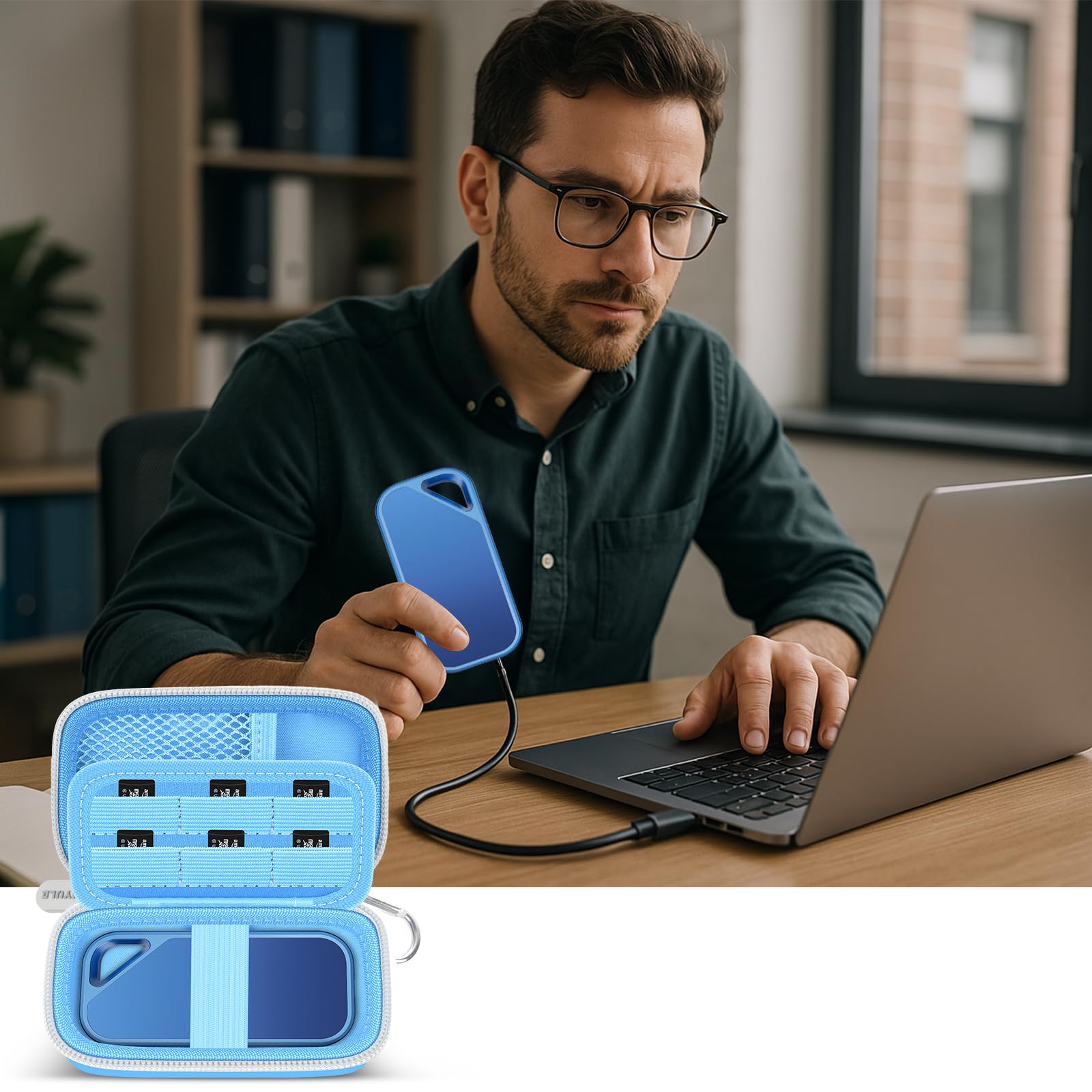 Man using a SanDisk portable SSD beside the open blue organizer and laptop