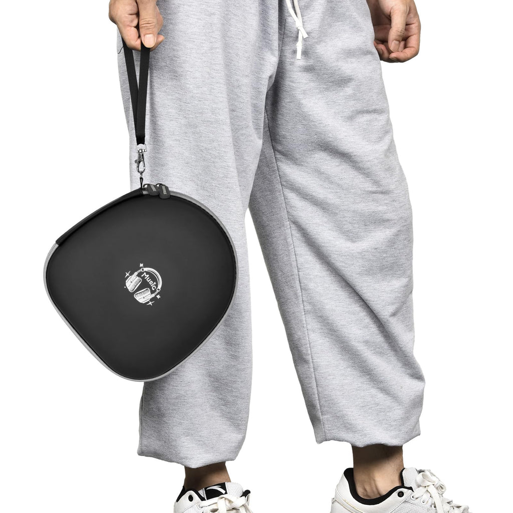 Person carrying the black headphone case by its wrist strap