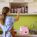 Pink label maker case beside a mini printer in a kitchen organization scene