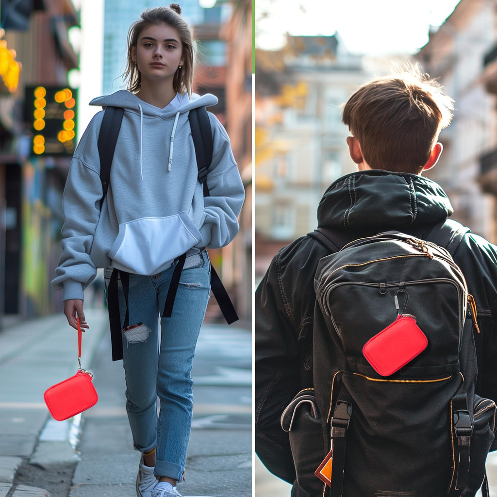 Red JBL Go speaker case carried by hand and attached to a backpack