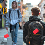 Red JBL Go speaker case carried by hand and attached to a backpack