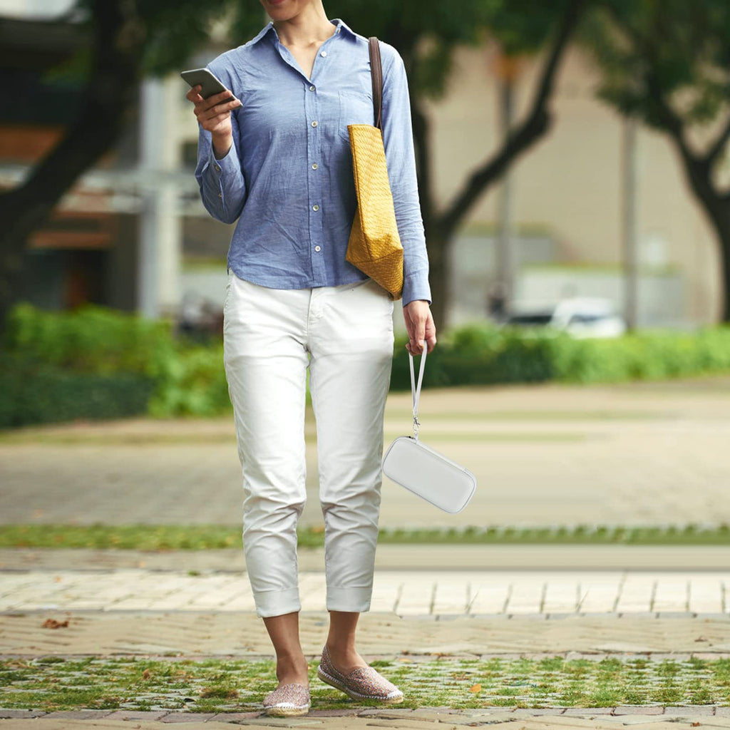 Person carrying the white power bank case by its wrist strap