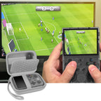 Gray retro handheld console carrying case shown open beside a handheld console during gameplay