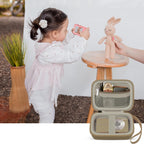 Khaki protective digital camera case shown beside a child using a compact camera