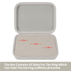 Open ivory jewelry organizer showing 42 padded slots for rings and small accessories