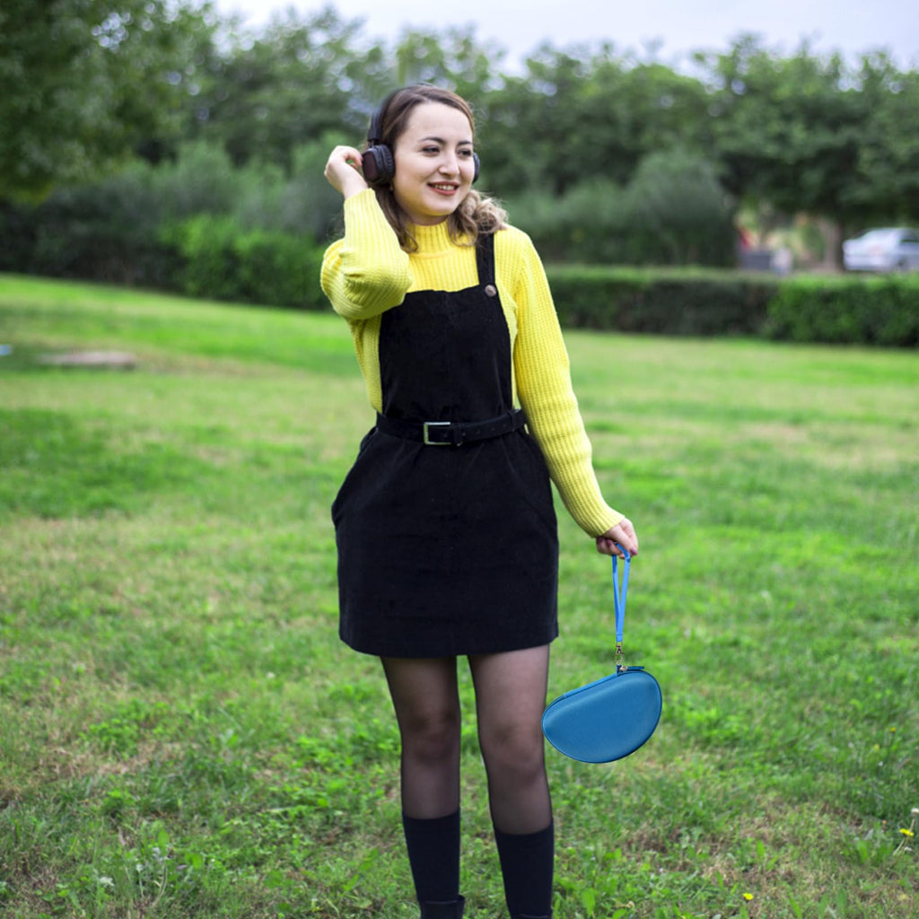 Woman carrying the blue headphone case by its wrist strap