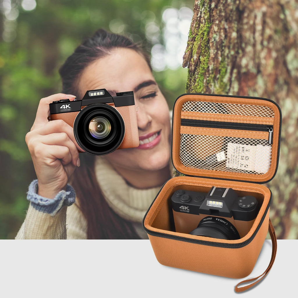 Photographer using a compact camera beside the open orange organizer