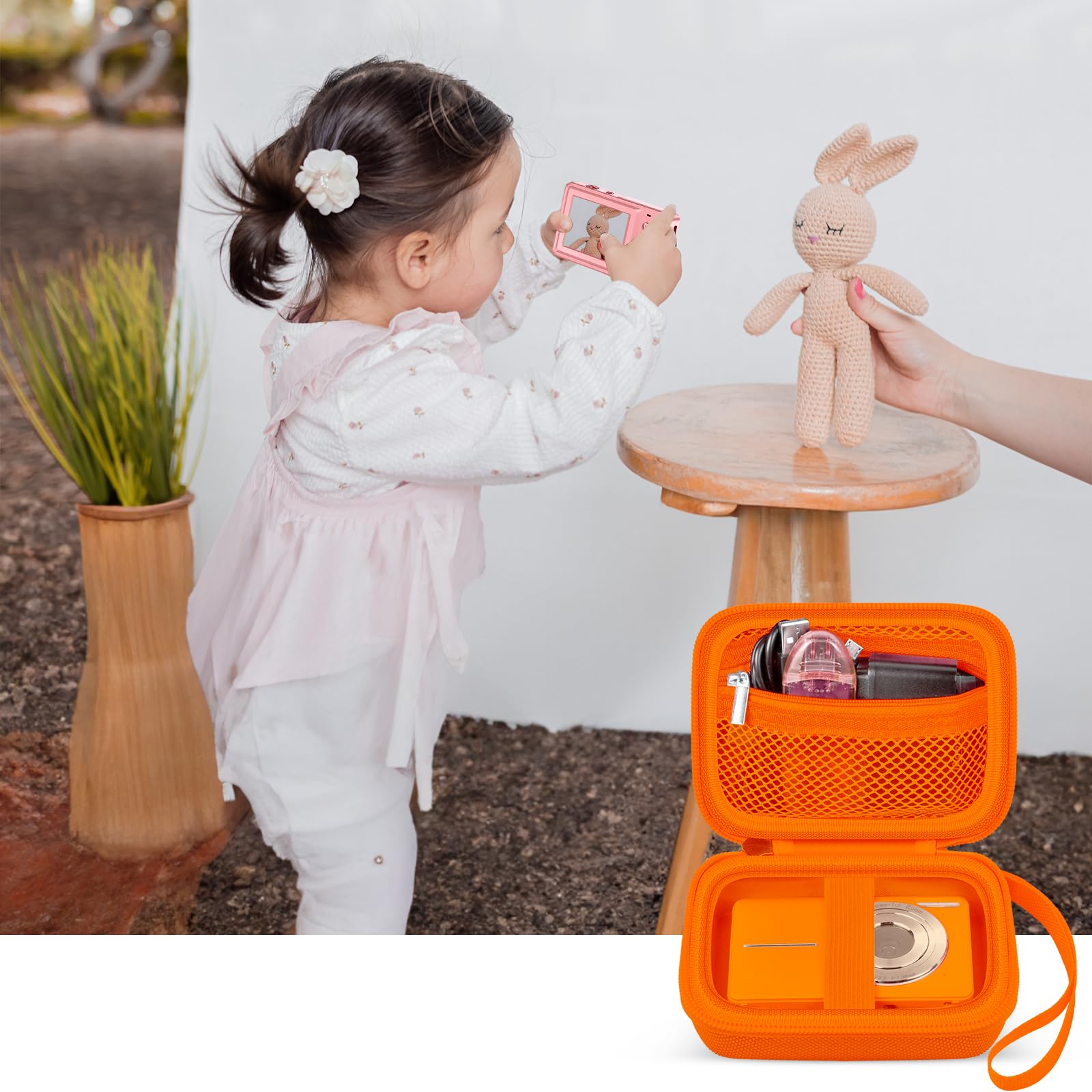 Orange protective digital camera case shown beside a child using a compact camera