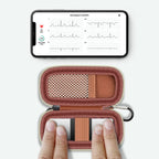 KardiaMobile 6L device used inside the open rose gold travel case without removal